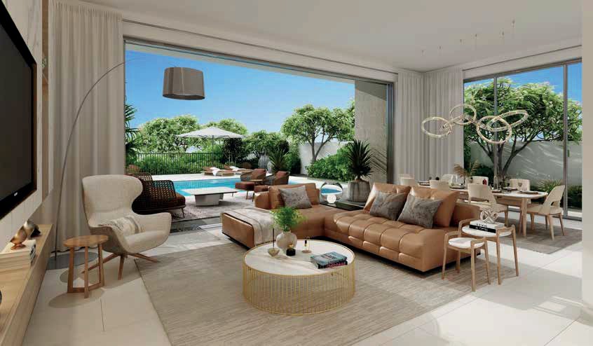 Bright living room interior of a Jebel Ali Village home with garden view